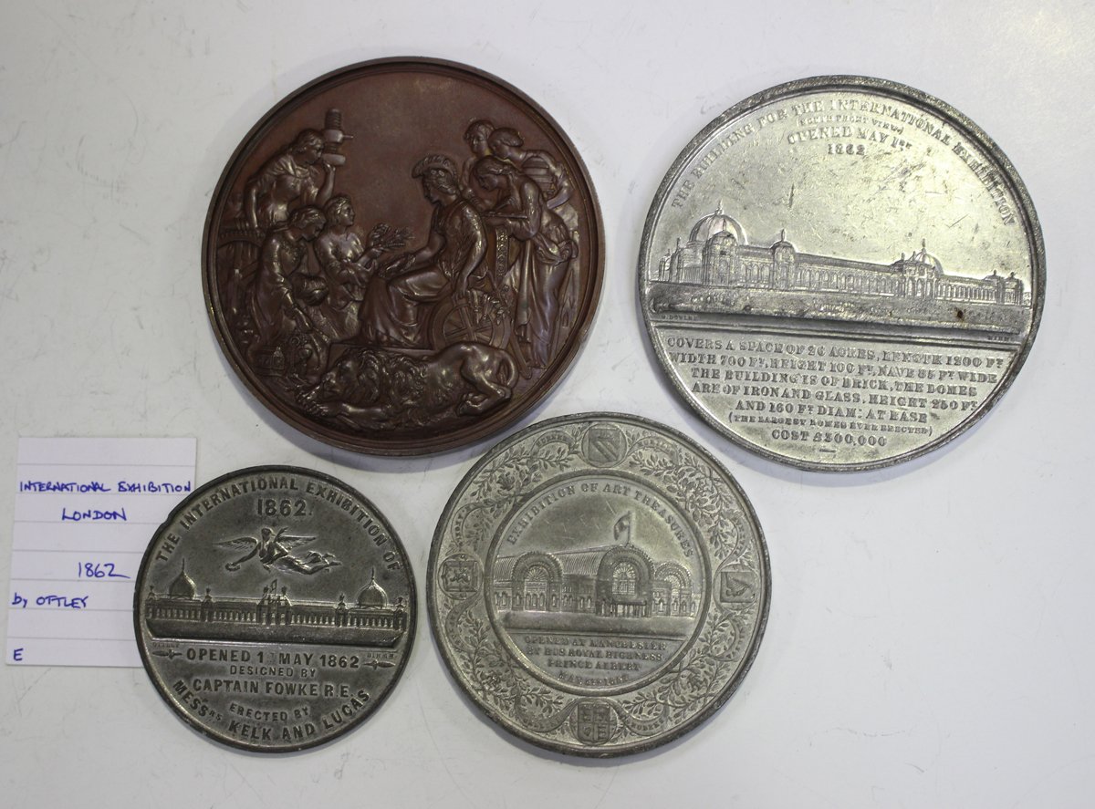 A white base metal medallion, detailed 'The Crystal Palace designed by Sir Joseph Paxton, opened