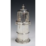 A late Victorian silver lighthouse sugar caster, the pierced and domed cover with turned finial