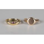 An 18ct gold, ruby and colourless gem set five stone ring in a boat shaped design, ring size