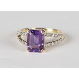 A 9ct gold, amethyst and diamond ring, claw set with a cut cornered rectangular step cut amethyst