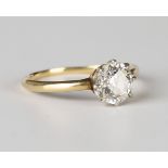 A gold and diamond single stone ring, claw set with a cushion cut diamond, ring size approx M.