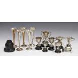 A set of five Edwardian silver spill vases, each with pinched and beaded trefoil rim, Birmingham