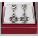 A pair of diamond pendant earrings, each drop collet set with a circular cut diamond within a