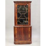 A late Victorian figured mahogany floor standing corner cabinet, height 204cm, width 88cm.Buyer’s