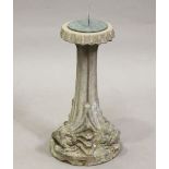 A 20th century cast composition stone sundial pedestal with triple dolphin support, the top with