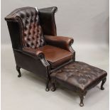 A late 20th century George III style buttoned brown leather wingback armchair, height 105cm, width