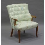 A George V walnut framed tub back showframe armchair, upholstered in a pale green damask of