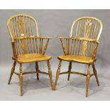 A pair of modern reproduction ash and elm pierced splat back Windsor armchairs with crinoline