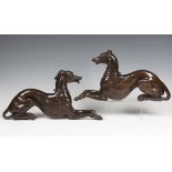 A pair of impressive carved oak single-sided models of facing recumbent greyhounds, 18th century