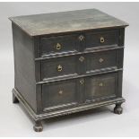 A 19th century William and Mary style stained oak chest of three long drawers, on turned feet,