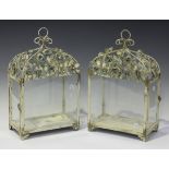 A set of four early 20th century tole painted tin hanging lanterns, the arched tops embellished with