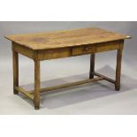 An 18th century French provincial farmhouse table, the three-plank top above a single frieze drawer,