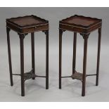 A near pair of 20th century George III style mahogany kettle stands, the gallery tops above