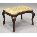 An early 20th century George I style walnut rectangular stool of serpentine outline, on cabriole