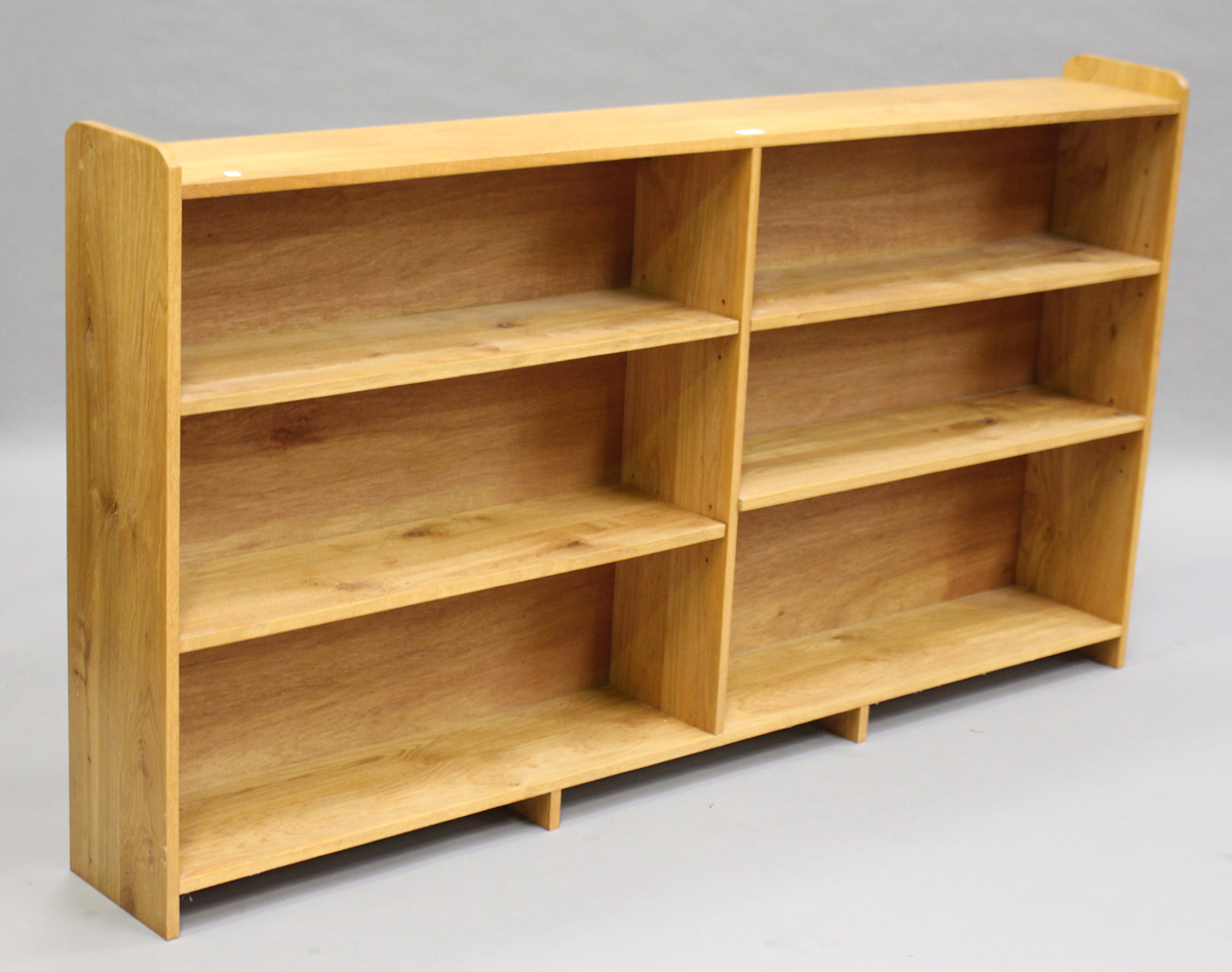 A modern oak two-section three-tier open bookcase, height 100cm, width 184cm, depth 25cm.Buyer’s