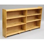 A modern oak two-section three-tier open bookcase, height 100cm, width 184cm, depth 25cm.Buyer’s