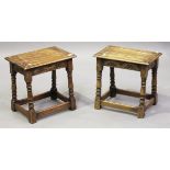 A pair of mid-20th century Jacobean Revival oak joint stools, height 44cm, width 46cm, depth 30cm.