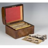 A late Victorian stereoscopic viewer, together with a burr walnut box, bearing ivory label inscribed