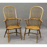 A pair of modern reproduction ash and elm Windsor armchairs with crinoline stretchers, height 110cm,