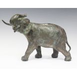 A late 20th century South-east Asian green patinated cast bronze model of an elephant, length 43cm.