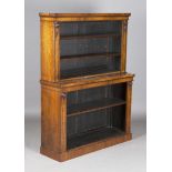 A Regency rosewood open bookcase of small proportions, the two graduated levels fitted with three