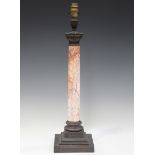 An early 20th century patinated brass and pink marble table lamp, height 50cm.Buyer’s Premium 29.