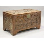 An early 20th century Chinese carved camphor trunk, height 57cm, width 101cm, depth 55cm.Buyer’s