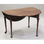 A George III mahogany circular drop-flap dining table, on turned legs and pad feet, height 74cm,