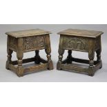 A pair of 20th century Jacobean Revival oak box seat joint stools with carved decoration, on