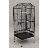 A modern Victorian style galvanized metal parrot cage, the arched top with hinged door above a front