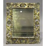 A 19th century Florentine giltwood and gesso wall mirror, the frame carved with flowerheads and