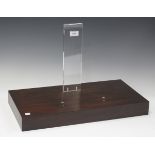 A modern mahogany and acrylic Dauphin picture display stand, height 37cm, width 54cm.Buyer’s Premium