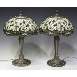 A pair of modern Tiffany style table lamps with dragonfly leaded glass shades and matching bases,