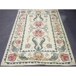 An Indian chain stitch Arts and Crafts style carpet, late 20th century, made for Harvey Nichols, the