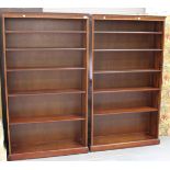 A pair of late 20th century reproduction mahogany open bookcases, height 184cm, width 105cm, depth