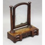 A Victorian mahogany arched swing frame mirror with octagonal supports, the base fitted with