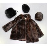 A mid-20th century half-length lady's mink coat by M & Michaels Furs of Bristol, length 68cm, a