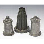 A collection of 19th and 20th century pewter items, including two Victorian aspic jelly moulds,