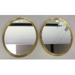 A pair of early/mid-20th century gilt composition oval mirrors, 54cm x 44cm.Buyer’s Premium 29.4% (