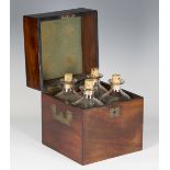 A George III mahogany decanter box, the interior fitted with four glass decanters with cork