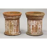 A pair of late 20th century terracotta garden planters of stop-fluted column form, height 37cm,