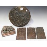 A late 20th century cast copper circular plaque, decorated with a classical maiden with two lions,