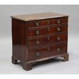 A George II walnut chest of four graduated long drawers, the top with crossbanded borders and