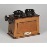 A late Victorian mahogany cased stereoscopic viewer by Arthur Gask & Coy, bearing maker's label,