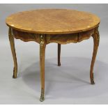 An early 20th century French walnut and parquetry inlaid circular dining table with gilt metal