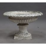 A 20th century white painted cast metal circular garden urn of shallow reeded form, height 48cm,