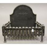 A 20th century cast and wrought iron fire grate with integral arched back, height 55cm, width 70cm.