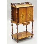 A late Victorian walnut side cabinet, inlaid with foliate urns, the two doors above an undertier,