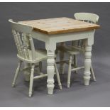 A 20th century pine and cream painted two-seater kitchen table, height 78.5cm, width 76cm, depth