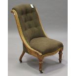 A late Victorian walnut showframe slipper chair, raised on fluted legs and china castors, height